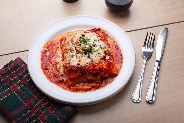 Lasagna Bolognese. Layers of flat lasagna noodles baked with alternating layers of slow-cooked Bolognese sauce, bechamel, and Parmesan cheese.