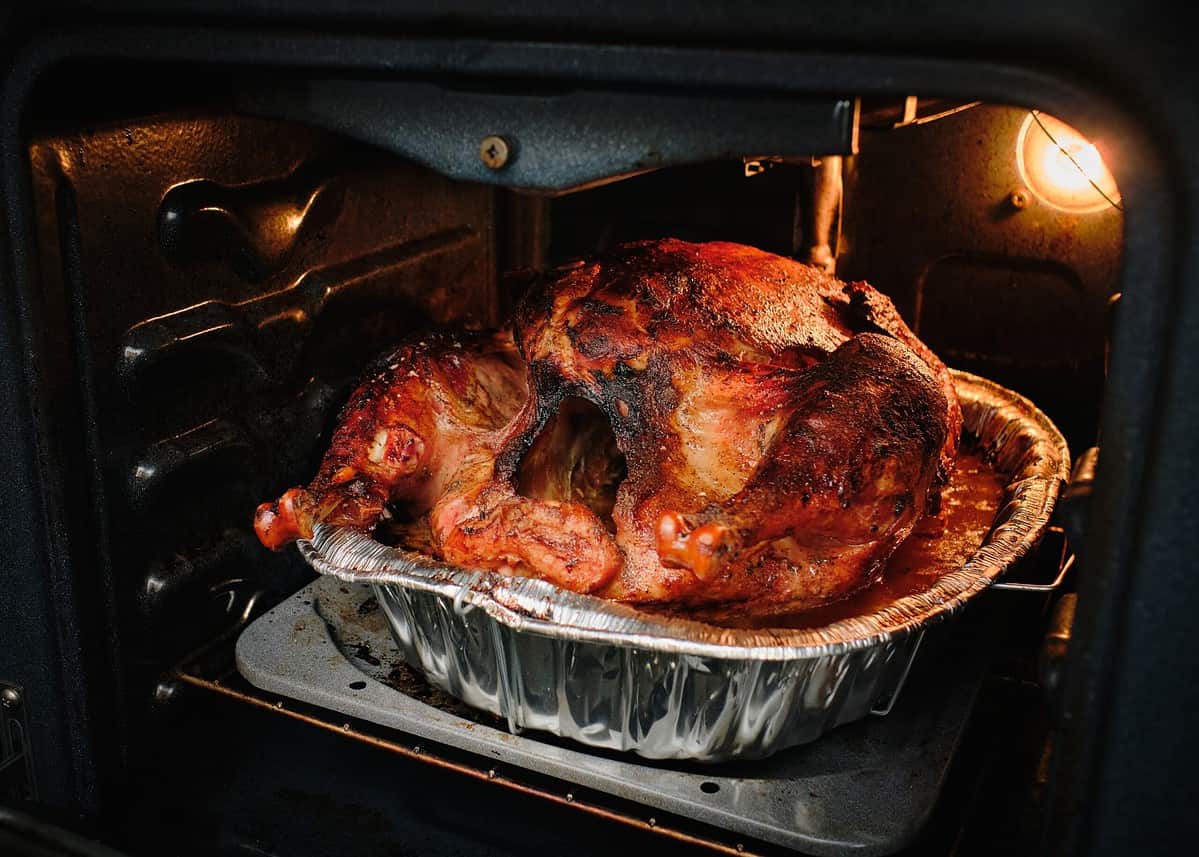 Thanksgiving turkey inside an open oven